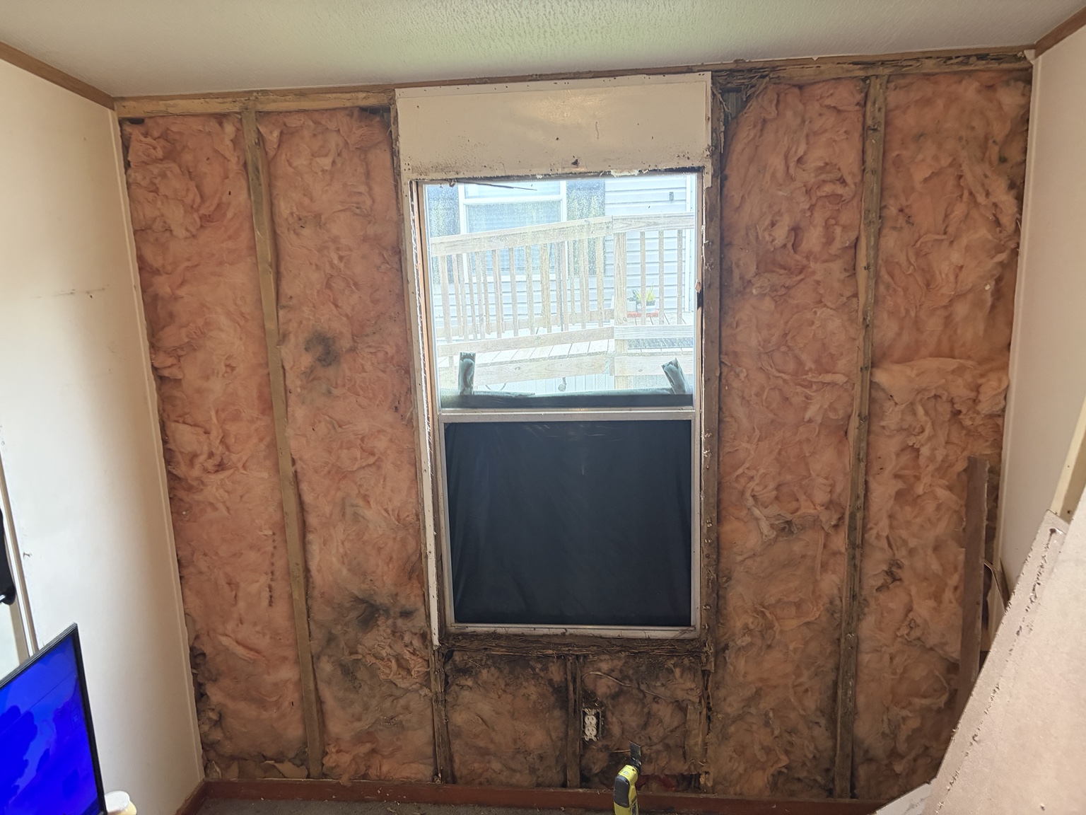 Interior wall and window repair in progress
